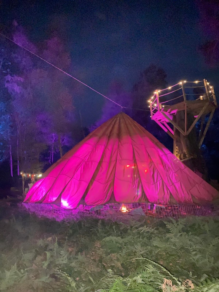 Camp kitchen beside the Land Rover and bell tent