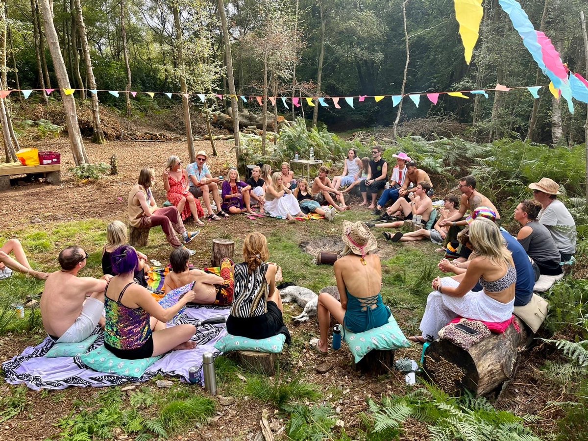 Everyone sat in a circle in the woods for the book reading and debate